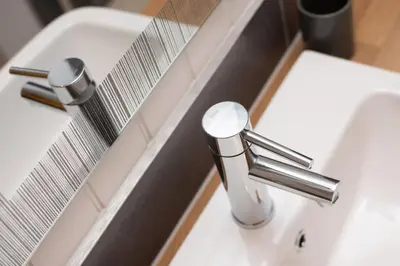 a white bathroom sink with a chrome faucet at Super King Lodge-Sleeps 2-HotTub-Sea View in Langbank