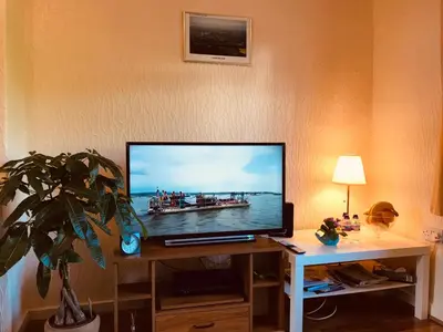 a flat screen tv sitting on top of a desk at Anna apartment in Edinburgh