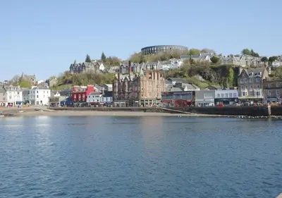 a town on the shore of a body of water at Panoramic Harbour View Apartment in Oban