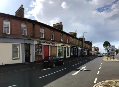 a car parked on the side of a street at Arran Ferry Apartment in Ardrossan