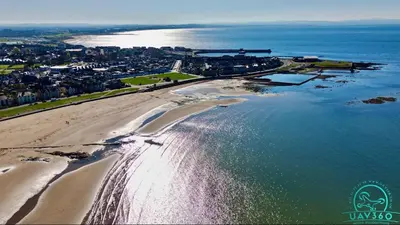 an aerial view of a beach and the ocean at Arran Ferry Apartment in Ardrossan