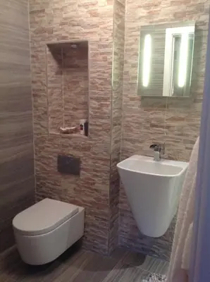 a bathroom with a white toilet and a sink at Saorsa House Culross in Fife