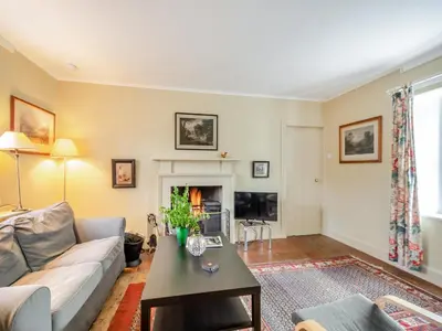 a living room with a couch and a table at Inverglen Farm in Strachur