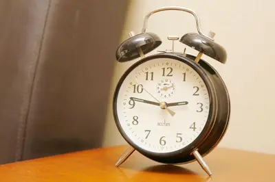 an alarm clock sitting on top of a table at The Dunning Hotel in Perth