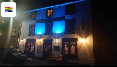 a building with two blue lights on the side of it at The Dunning Hotel in Perth
