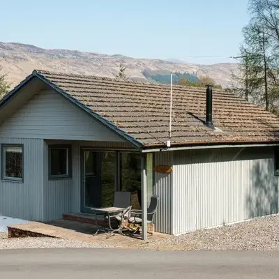 Deerstalker Lodge cozy lodge with wood burner