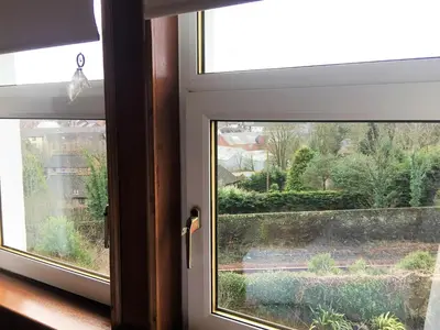 a window with a view of a garden at Glasgow Emo in Glasgow