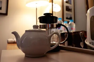 a tea pot sitting on a counter next to a coffee maker at Gowanlea Heights in Campbeltown