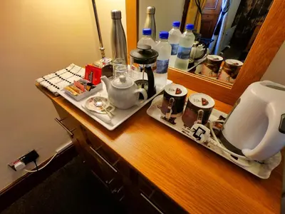 a bathroom counter with a sink and a mirror at Gowanlea Heights in Campbeltown
