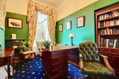 an office with a desk and a chair and a window at Duneira House in Helensburgh