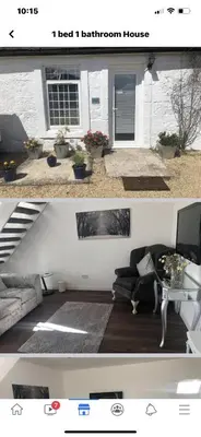 a living room with a couch and a table at GROOMS COTTAGE OUTSIDE HOT TUB in Beith
