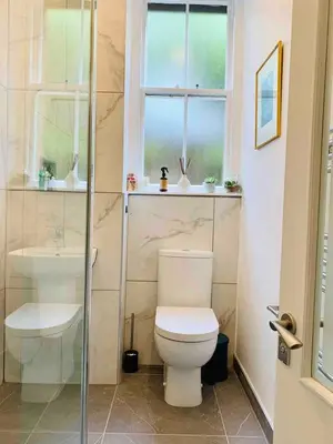 a bathroom with a toilet and a sink at Grassmarket Jewel in Edinburgh