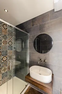 a bathroom with a sink and a shower at Sweeney Motherwell in Motherwell