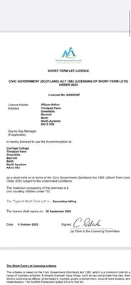 a letter from the department of homeland security with the required documentation at COACHMAN COTTAGE OUTSIDE HOT TUB in Beith