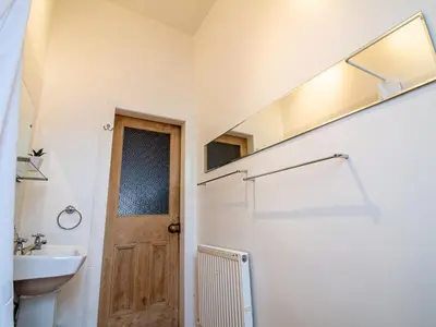 a bathroom with a toilet and a sink at Beautiful and Bright Georgian Style Morningside Apartment - Pass the Keys in Edinburgh