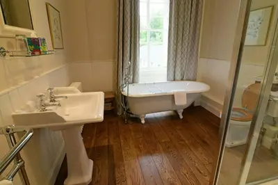a bathroom with a tub and a sink and a shower at Chesthill House and Estate, Glen Lyon in Aberfeldy