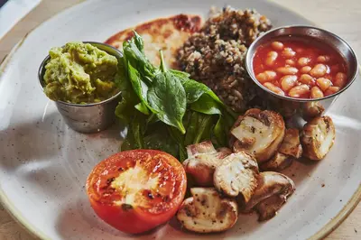 a plate of food with meat and vegetables and other foods at Brambles of Inveraray in Inveraray