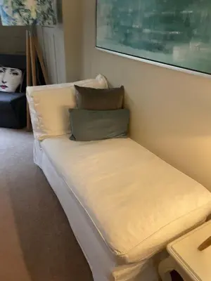 a couch with pillows on it in a room at Stylish City Centre Apartment in Edinburgh