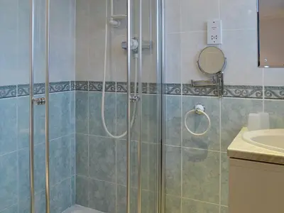 a bathroom with a shower and a sink at West Tannacrieff in Stewarton