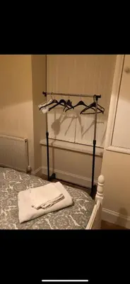 a bedroom with a bed with a towel on it at 105 Nelson Street in Largs