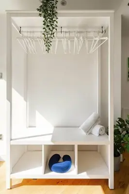 a white shelf with blue bowls in a room at Central, Bright 2 Bed Flat - Pool & Sauna in Edinburgh