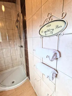 a bathroom with a shower and two towels at Lomond 3 with Private Hot Tub - Fife - Loch Leven - Lomond Hills -Pet Friendly in Kelty