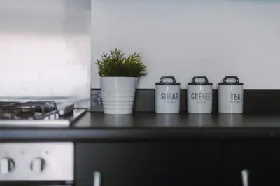 a group of four coffee cups sitting on a counter at RelaxingSleep Apartments in Glasgow