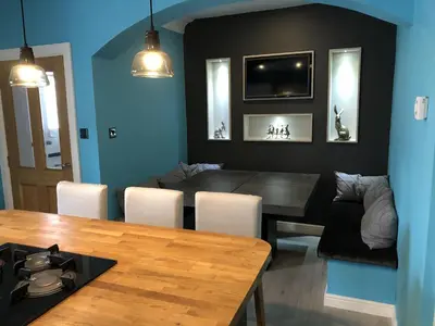 a kitchen and dining room with a table and chairs at Garron House in Auchterarder