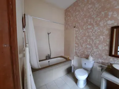 a bathroom with a bath tub and a toilet at Cornwall Street - 297 in Edinburgh