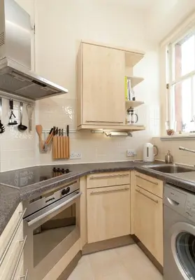 a kitchen with a sink and a dishwasher at Mardale Crescent - 380 in Edinburgh