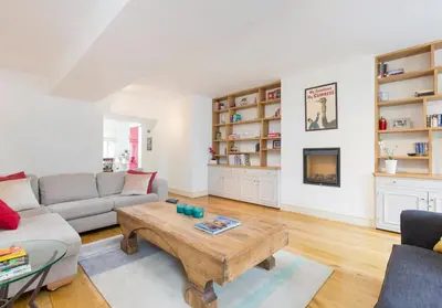 a living room with a couch and a coffee table at Thistle Street - 401 in Edinburgh