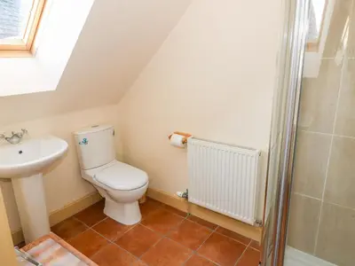 a bathroom with a toilet and a sink at The Roundhouse in Auchterarder