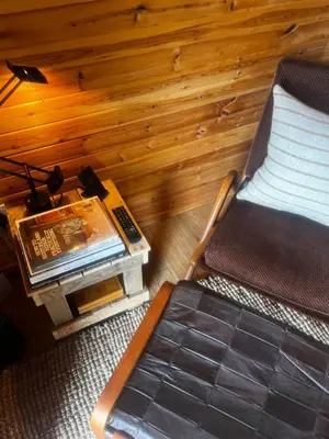 a room with a bed and a table and a chair at Stoneymollan over Loch Lomond in Balloch
