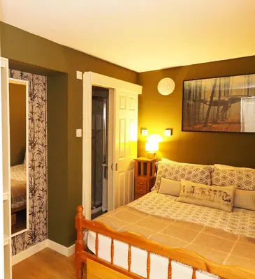 a bedroom with a bed in a room at Arrochar Alps Apartment in Arrochar