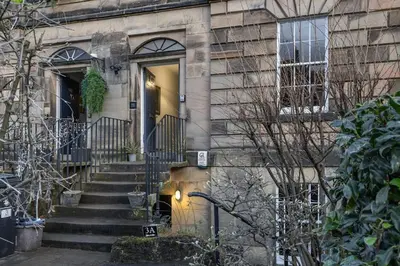 a building with a staircase leading to a door at The Stirling Townhouse in Stirling