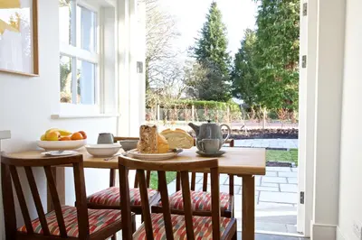 a kitchen with a table with food on it at Ross Lodge in Comrie