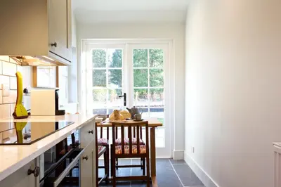 a kitchen with a counter and a window at Ross Lodge in Comrie