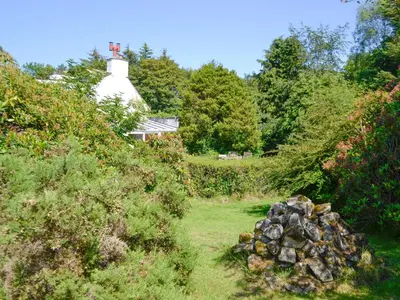 a pile of rocks in front of a house at The Old Schoolhouse in Colfin