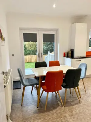 a dining room with a table and chairs at Leworin in Stirling