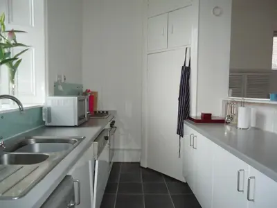 a kitchen with a sink and a microwave at Bishopton Apartment, near Glasgow in Bishopton