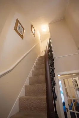 a staircase in a home with a stair case at Sandgate 2-Bed Apartment in Ayr central location in Ayr