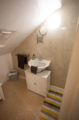 a bathroom with a white sink and a sink at Sandgate 2-Bed Apartment in Ayr central location in Ayr