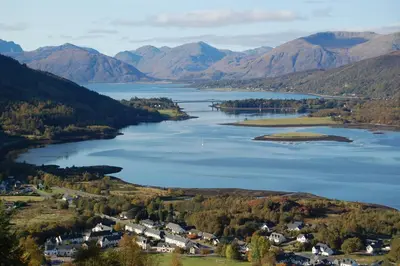 an aerial view of a lake in the mountains at Duart Cottage in Glencoe