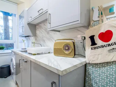 a kitchen with a counter top with a toaster on it at Stylish & Charming Retreat for 2- City Centre! - Pass the Keys in Edinburgh