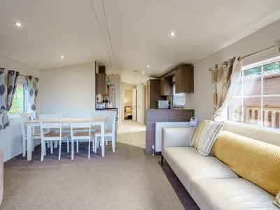 a living room with a couch and a table at The Orchard - Uk7111 in Alloa