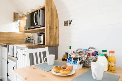 a kitchen with a table with a plate of food on it at Weedingshall Lodges in Falkirk