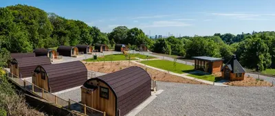 a group of small buildings in a park at Weedingshall Lodges in Falkirk