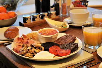 a table with a plate of breakfast food on it at Clyde View B&B in Dunoon