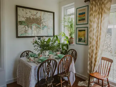 a dining room with a table and chairs with a tableclotholitics at Wild Geese Lodge - Uk31046 in Portpatrick