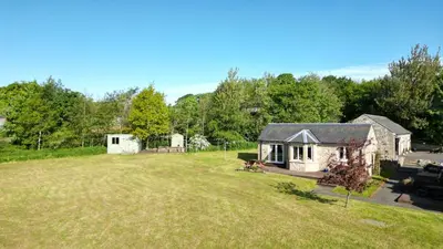 an aerial view of a house with a large yard at The Ploughman's Poet in Bathgate
